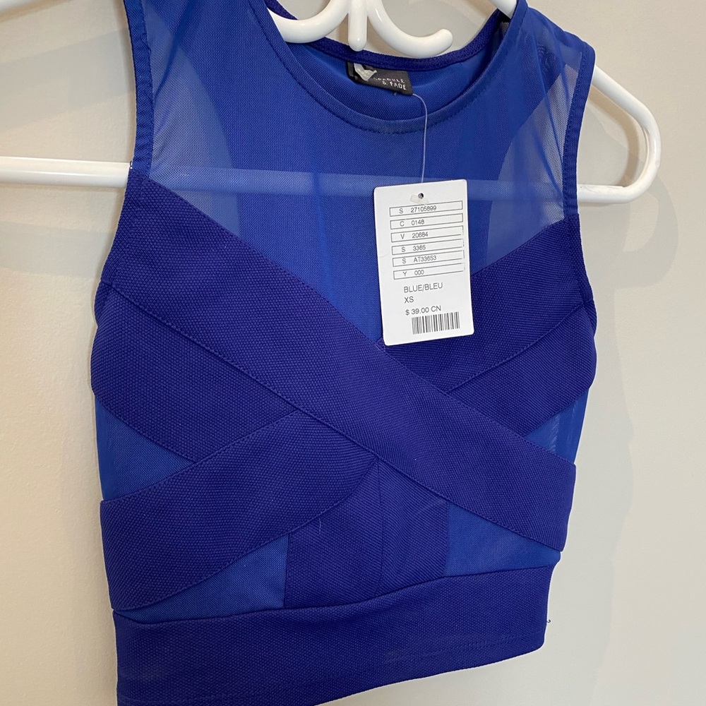 Blue cropped top with bandage features.